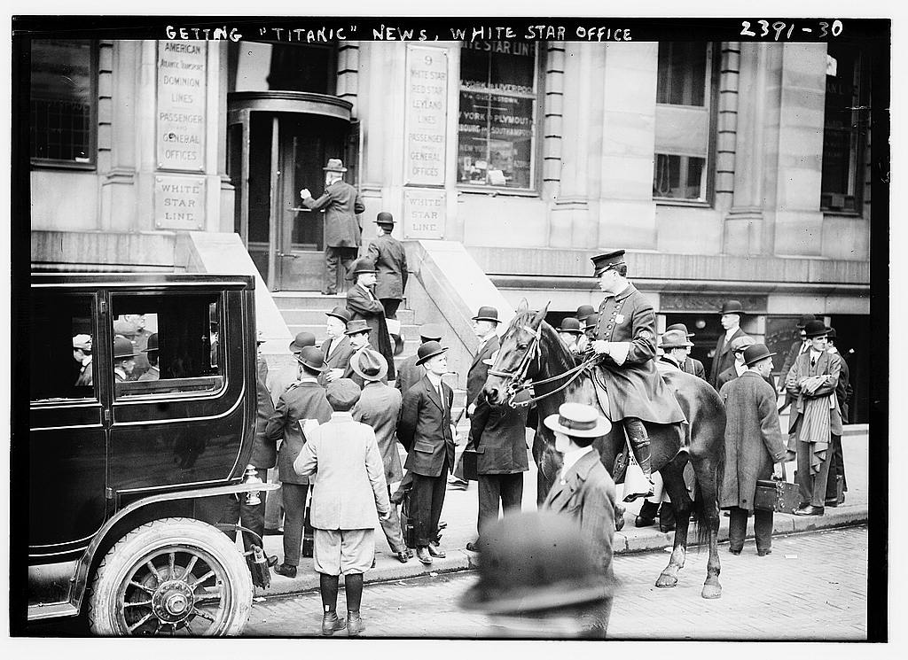 People waiting for Titanic news at a White Star Line office in April 1912